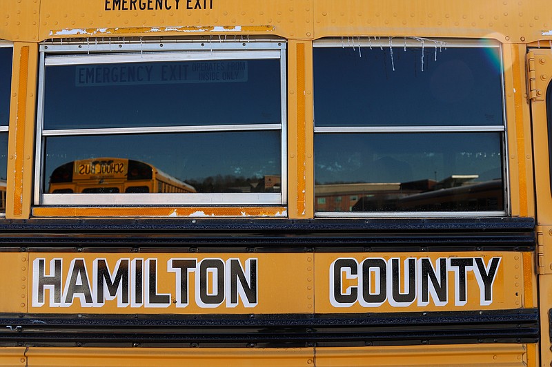Staff photo by Olivia Ross / Icicles hang from school buses parked at East Hamilton High School on Jan. 17.