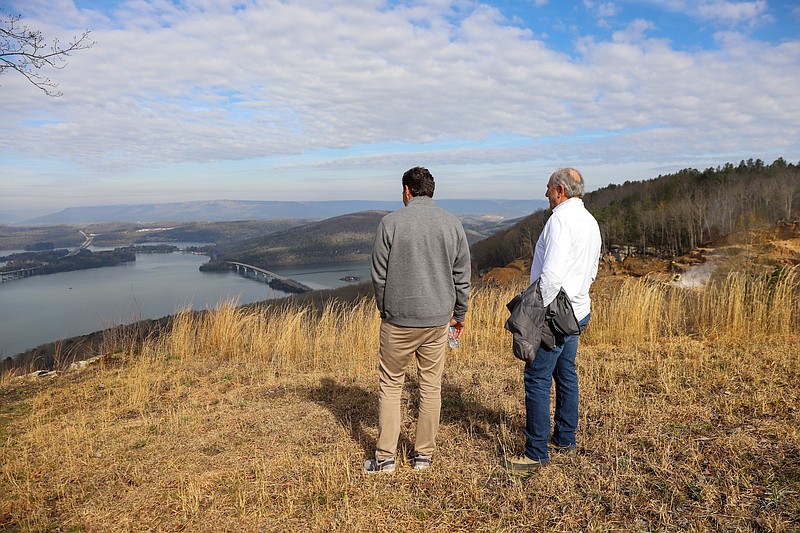 Staff photo by Olivia Ross / Dane Bradshaw, president of Thunder Enterprises, and John “Thunder” Thornton look out over Nickajack Lake from the River Gorge Ranch property on March 23, 2023. Thornton and Bradshaw defended the development at a March 2024 Marion County Commission meeting over recent comments about alleged problems associated with old coal mines raised recently by neighbors to the project.