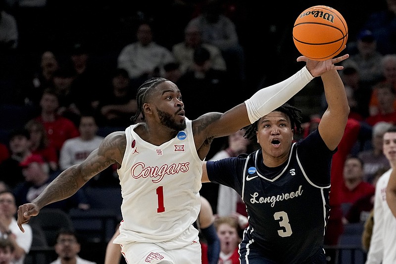 AP photo by George Walker IV / Houston's Jamal Shead (1) grabs a loose ball in front of Longwood guard DA Houston during an NCAA tournament first-round game last Friday in Memphis.