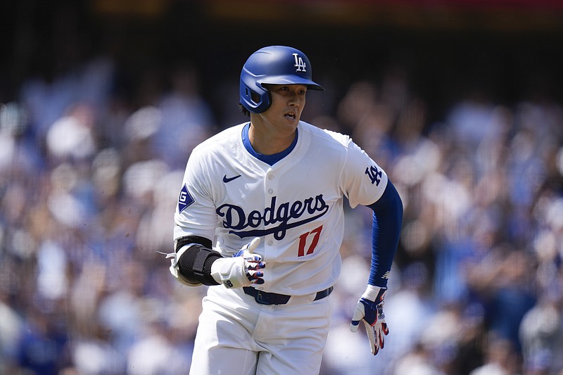 AP photo by Jae C. Hong / Los Angeles Dodgers designated hitter Shohei Ohtani runs down the first-base line after hitting a double during the first inning of Thursday's game against the visiting St. Louis Cardinals.