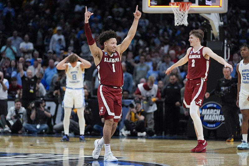 AP photo by Ryan Sun / Alabama guard Mark Sears (1) and forward Grant Nelson celebrate after the West Region's fourth-seeded Crimson Tide beat top-seeded North Carolina in the NCAA tournament's Sweet 16 on Thursday night in Los Angeles.