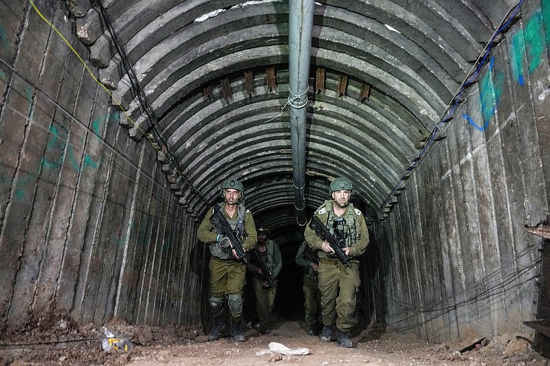 AP File Photo/Ariel Schalit / Israeli soldiers are seen in a tunnel that its military says Hamas militants used to attack the Erez crossing in the northern Gaza Strip on Friday, Dec. 15, 2023.