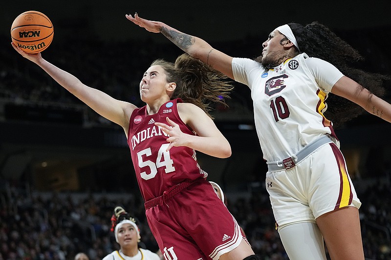 AP photo by Mary Altaffer / Indiana forward Mackenzie Holmes shoots as South Carolina center Kamilla Cardoso defends during an NCAA tournament Sweet 16 game Friday in Albany, N.Y.