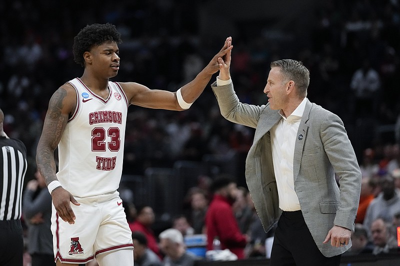 AP photo by Ashley Landis / Alabama forward Nick Pringle is high-fived by coach Nate Oats during the team's NCAA tournament Elite Eight win against Clemson on Saturday night in Los Angeles.