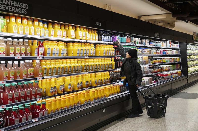 File photo/Hiroko Masuike/The New York Times / Shopping browse in a grocery store in the East Village of Manhattan on Feb. 15, 2024. A common corporate strategy — for decades — has been to shrink products to to avoid raising prices.