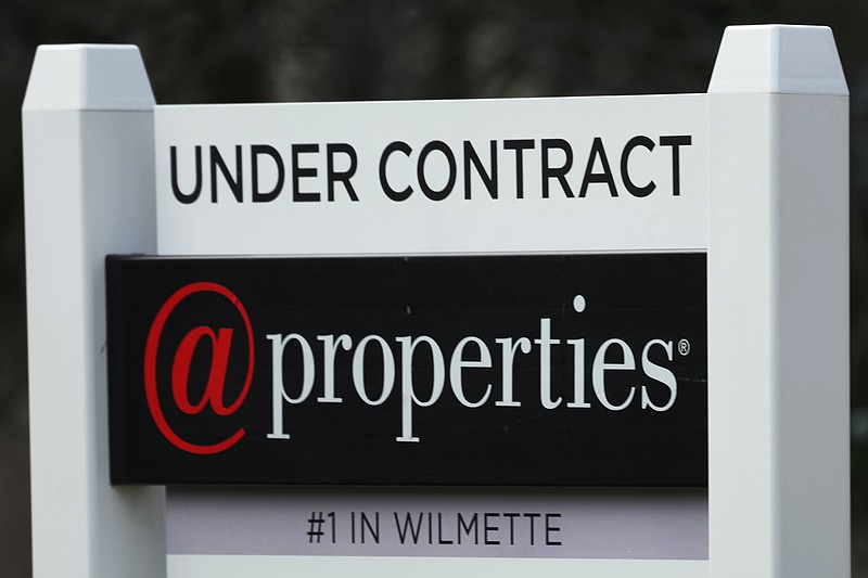 A sign announcing that a home is under contract is displayed in Wilmette, Ill., Thursday, March 28, 2024. On Thursday, April 4, 2024, Freddie Mac reports on this week's average U.S. mortgage rates. (AP Photo/Nam Y. Huh)