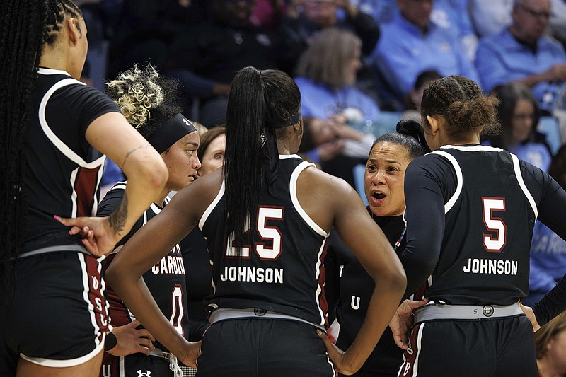 AP photo by Ben McKeown / South Carolina women's basketball coach Dawn Staley speaks with her players during a game at North Carolina on Nov. 30.