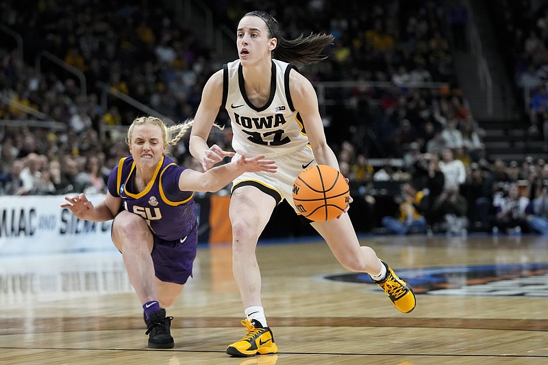 AP photo by Mary Altaffer / Iowa's Caitlin Clark dribbles as LSU guard Hailey Van Lith tries to steal the ball during an NCAA tournament Elite Eight game Monday night in Albany, N.Y.