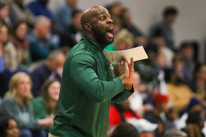 Staff photo by Olivia Ross / Notre Dame's Head Coach Jonathan Adams calls out from the sidelines. Notre Dame took on McCallie during the Best of Preps tournament semifinals on Friday, December 29, 2023 at Chattanooga State Community College.