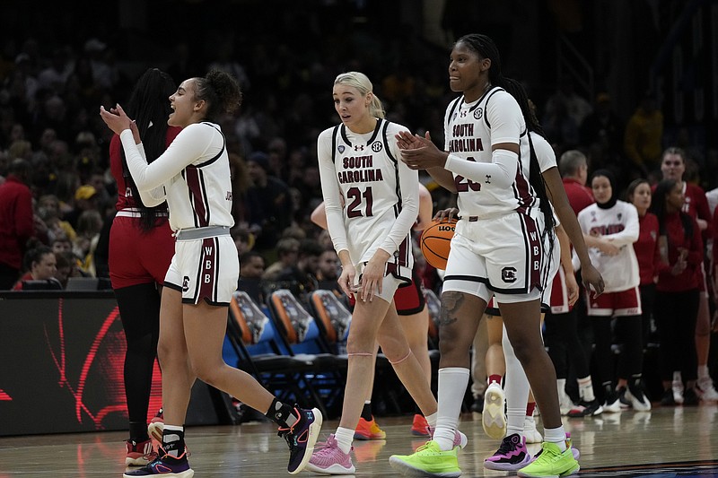South Carolina players celebrate at the end of a Final Four college basketball game against North Carolina State in the women's NCAA Tournament, Friday, April 5, 2024, in Cleveland. South Carolina won 78-59. (AP Photo/Carolyn Kaster)
