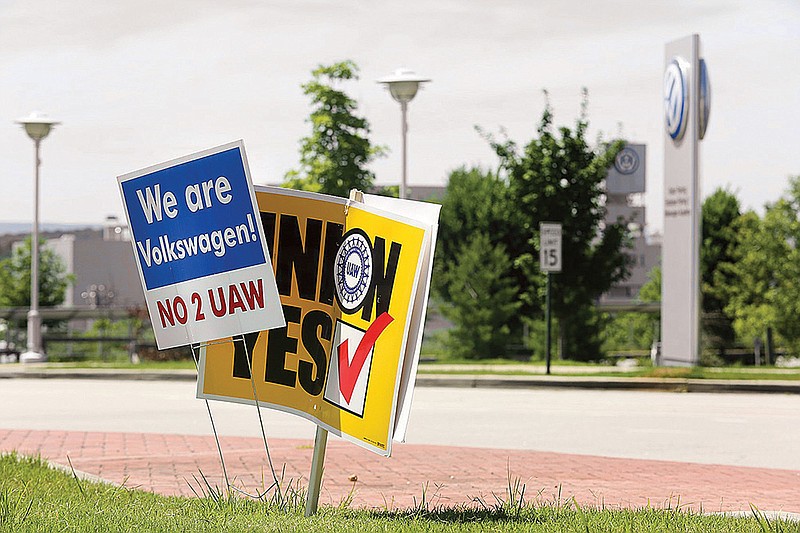 Staff photo by Erin O. Smith / 
Signs for and against unionization are in a roundabout along Volkswagen Drive in front of the Volkswagen plant Friday, June 14, 2019 in Chattanooga, Tennessee. Results from the Volkswagen union election will be released later tonight.