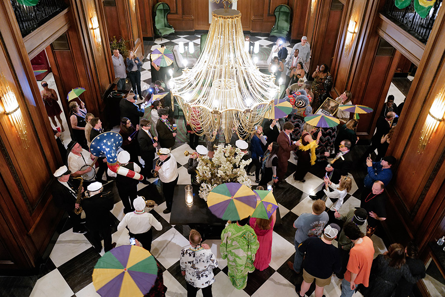 Photo by Mark Gilliland / Mardi Gras revelers parade inside the Read House.