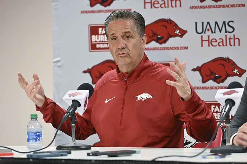 AP photo by Michael Woods / John Calipari answers questions from reporters after being introduced as the men's basketball coach at Arkansas on Wednesday in Fayetteville.