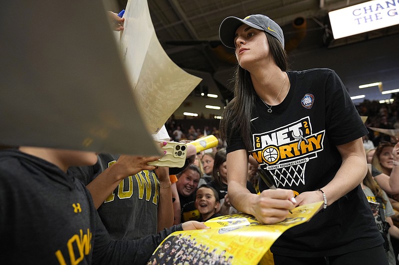 AP photo by Charlie Neibergall / Senior guard Caitlin Clark signs autographs during an Iowa women's basketball team celebration Wednesday in Iowa City. The Hawkeyes were national runners-up the past two seasons, losing to undefeated South Carolina in Sunday's NCAA tournament final after falling to LSU a year ago.