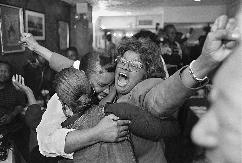 File photo/Ozier Muhammad/The New York Times — Sylvia Woods, the owner of a popular restaurant in Harlem, celebrates the acquittal of O.J. Simpson in New York, Oct. 3, 1995. It's not that most Black people thought [Simpson] innocent or another Rosa Parks. For them, it was the system itself that was on trial, as NYT columnist Charles M. Blow writes.