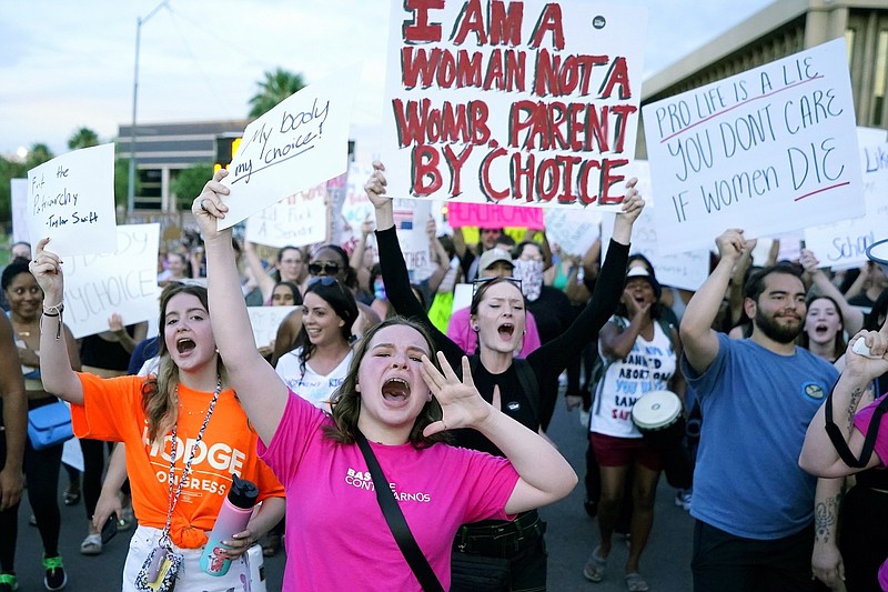 (AP file photo/Ross D. Franklin/The Associated Press / Protesters in Phoenix shout as they join thousands marching around the Arizona state Capitol after the U.S. Supreme Court decision to overturn the landmark Roe v. Wade abortion decision on June 24, 2022. A stunning abortion ruling last week has supercharged Arizona's role in the looming fall election.