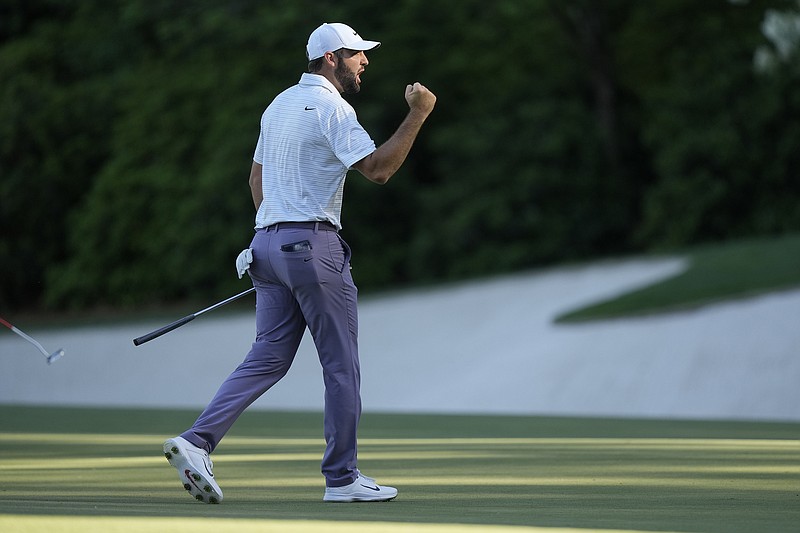 AP photo by Charlie Riedel / Scottie Scheffler celebrates after an eagle on the 13th hole at Augusta National Golf Club during third round of the Masters on Saturday.