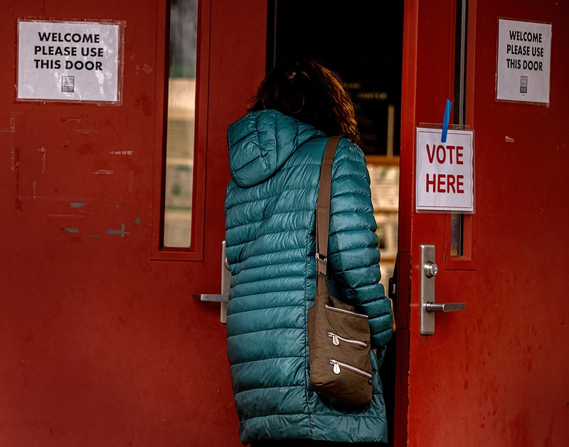 A woman enters the Shelby Park Community Center in Nashville to vote March 5 in the Super Tuesday primary. (Tennessee Lookout Photo by John Partipilo)