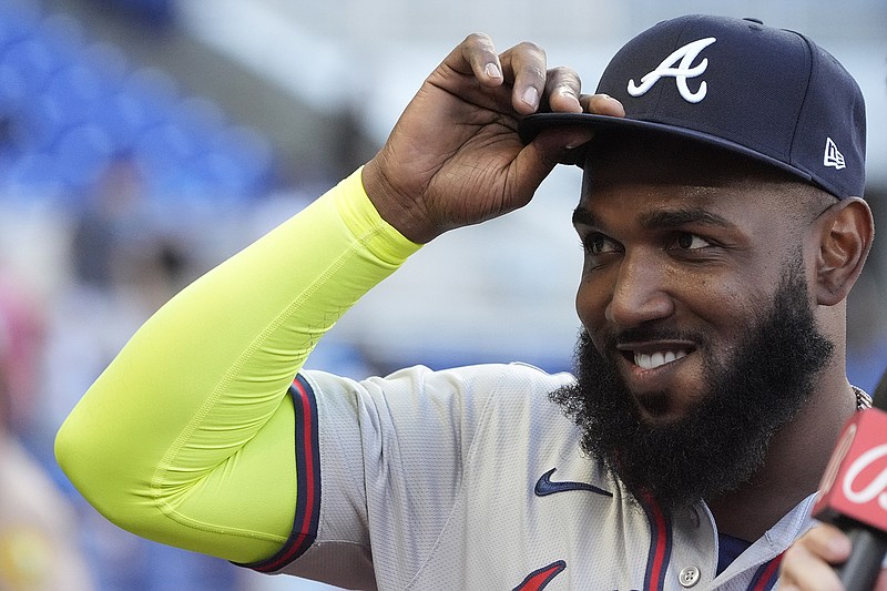 AP photo by Wilfredo Lee / Atlanta Braves designated hitter Marcell Ozuna tips his hat to the cheering crowd as he waits to be interviewed after the team's 9-7 comeback win against the Miami Marlins on Sunday in Florida. Ozuna's three-run homer with two outs in the top of the ninth inning put Atlanta ahead for good.
