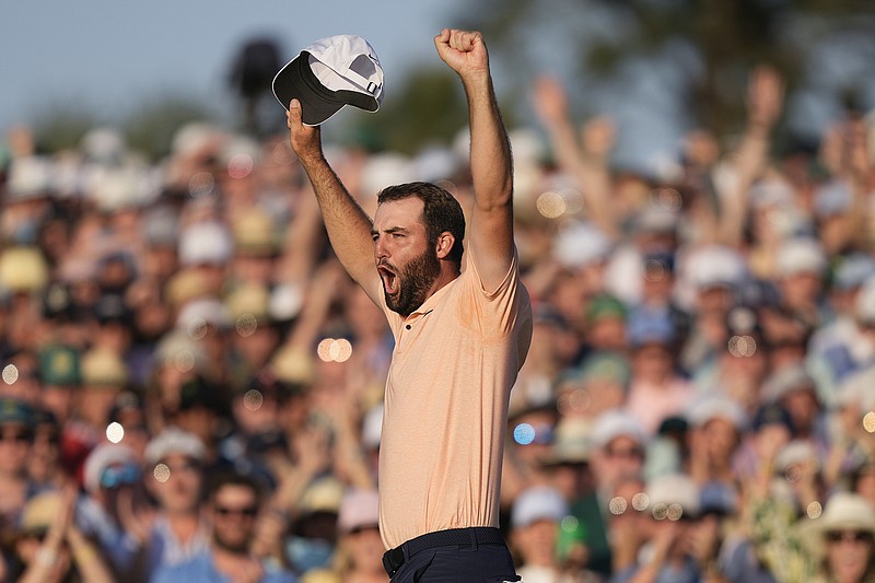 AP photo by Charlie Riedel / Scottie Scheffler celebrates on the 18th green at Augusta National Golf Club after winning the Masters on Sunday. Scheffler closed with a 68 and won by four strokes to earn the green jacket for the second time in three years.