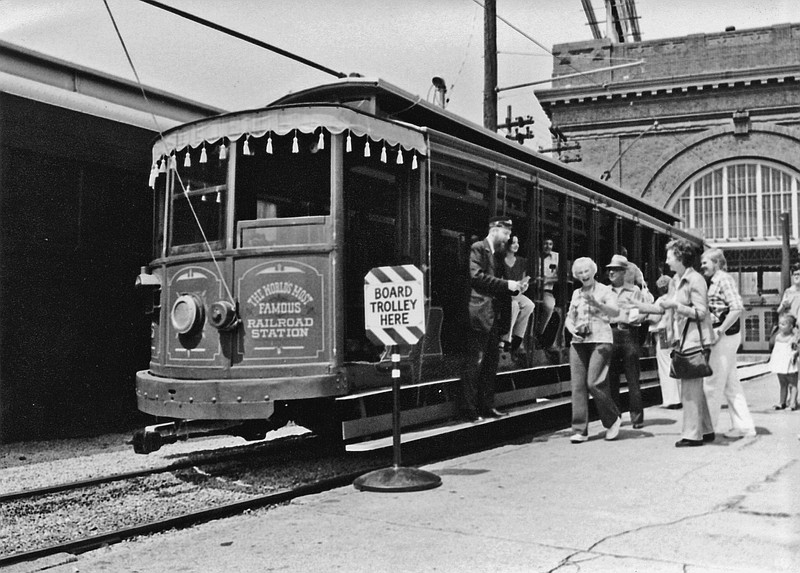 This archival photo shows a trolley parked outside Terminal Station/The Chattanooga Choo Choo many years ago. Notice the archway in the background, which is still part of the building today. At the time Terminal Station was built, this was the largest self-supporting arch in the world. Photo from City of Chattanooga / Streetcars in Chattanooga.