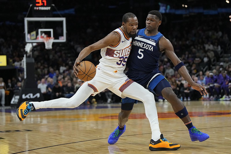 AP photo by Rick Scuteri / The Minnesota Timberwolves' Anthony Edwards (5) guards Phoenix Suns forward Kevin Durant on April 5 in Arizona. USA Basketball announced its men's roster for this summer's Paris Games on Wednesday, with Durant seeking his fourth gold medal and Edwards competing in the Olympics for the first time.