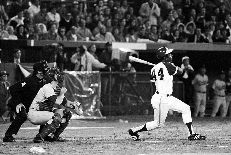 AP photo / The Atlanta Braves' Hank Aaron (44) breaks Babe Ruth's MLB record for career home runs as he hits No. 715 on April 8, 1974. The slugger's nickname, The Hammer, is nearly as iconic as this photo.