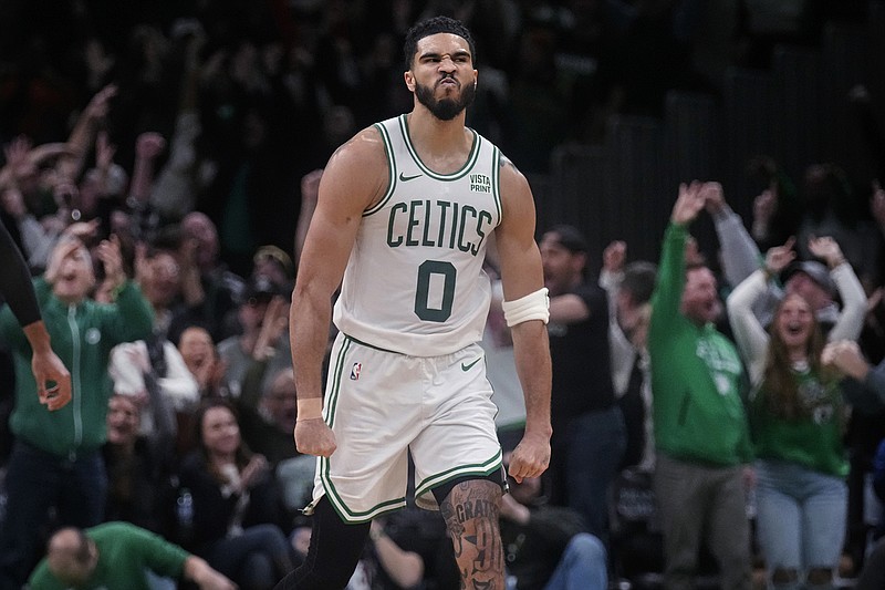 AP photo by Charles Krupa / Boston Celtics forward Jayson Tatum celebrates after making a 3-pointer during overtime of a 127-120 win against the visiting Minnesota Timberwolves on Jan. 10.