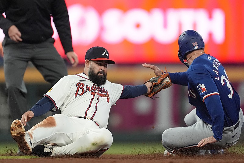 AP photo by John Bazemore / Atlanta Braves second baseman Luis Guillorme tags out the Texas Rangers' Evan Carter as he attempts to steals second in the seventh inning of Sunday's game.