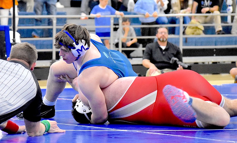 Staff photo by Patrick MacCoon / McCallie's Carson Gentle, top, helped the Blue Tornado end their state wrestling title drought that had dated back to 2006 this season.