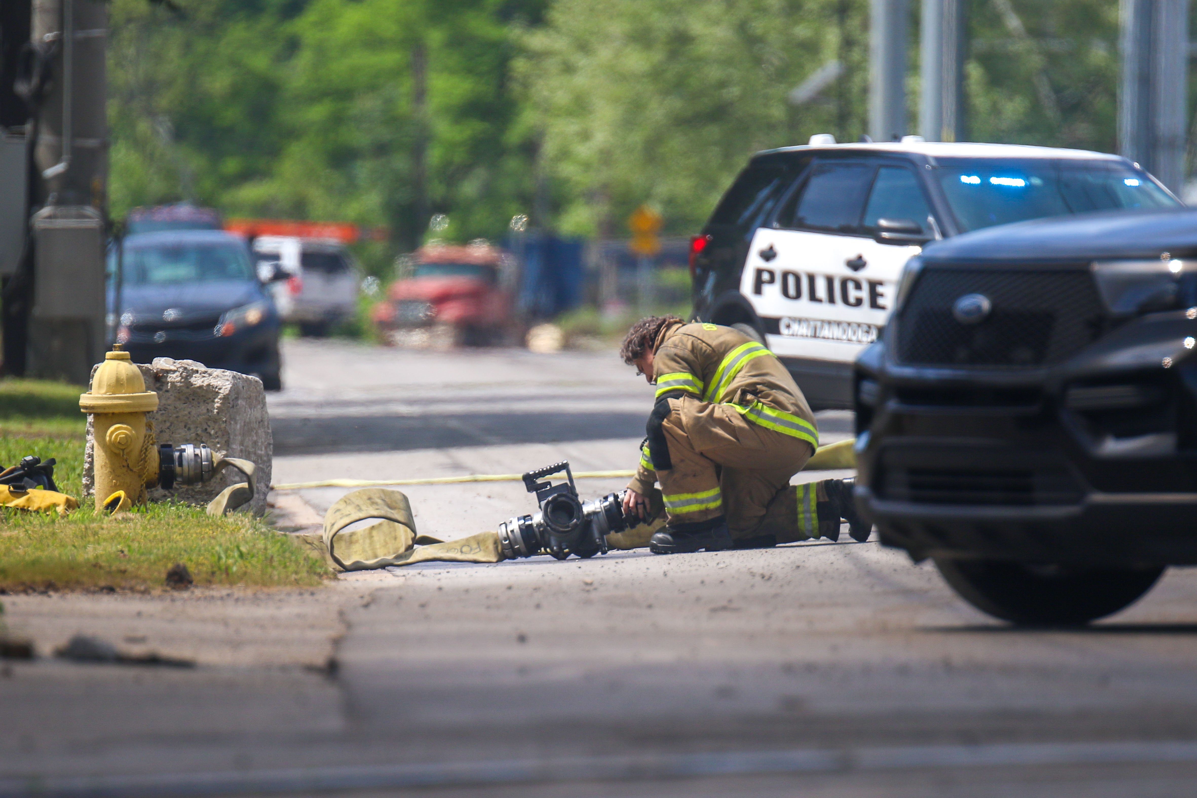 Staff photo by Olivia Ross / First responders arrive near 980 West 19th Street after clouds of smoke from a fire are seen on Tuesday.