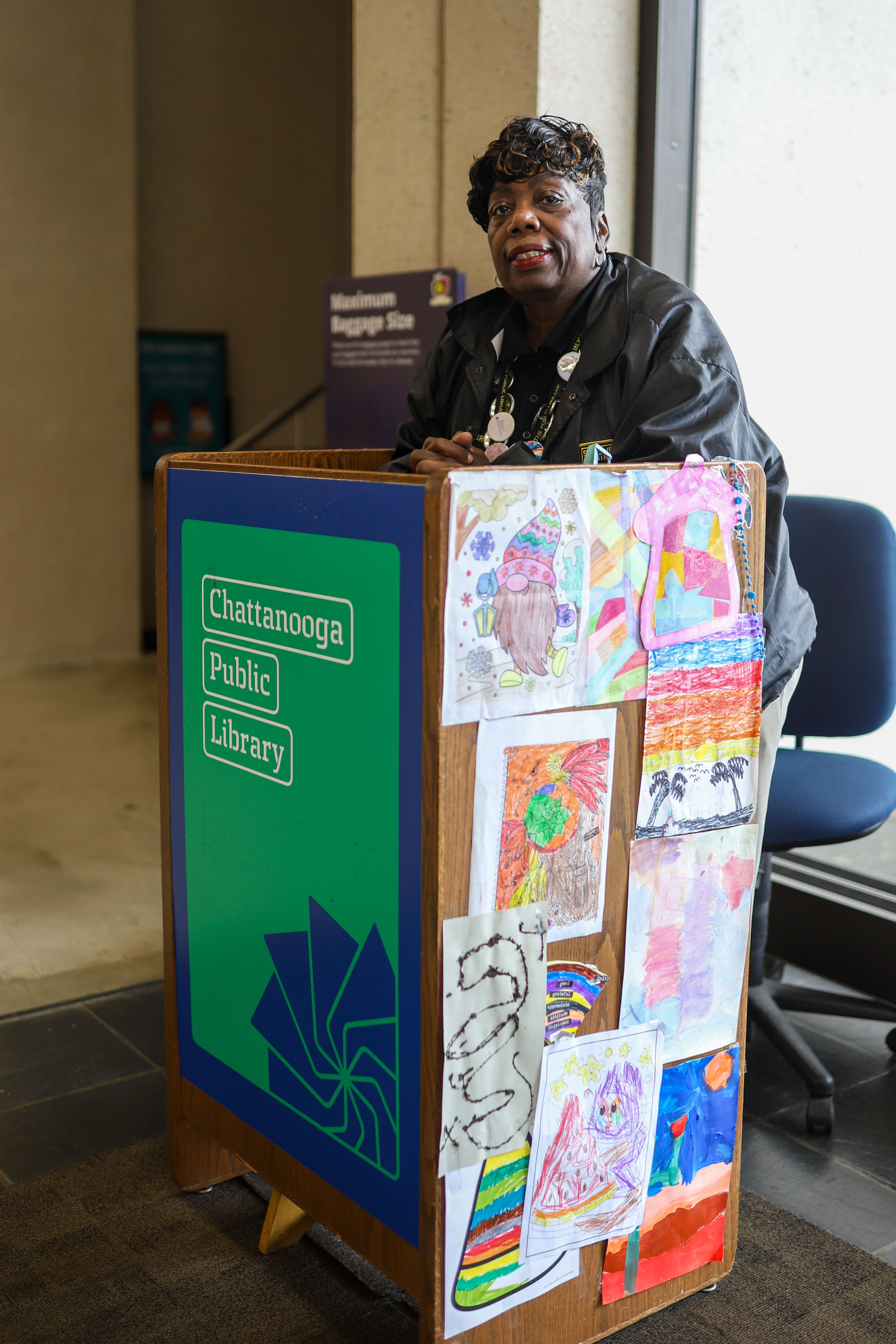 Staff photo by Olivia Ross / Security guard Jackie Strickland stands at her podium Tuesday at the Chattanooga Public Library downtown.
