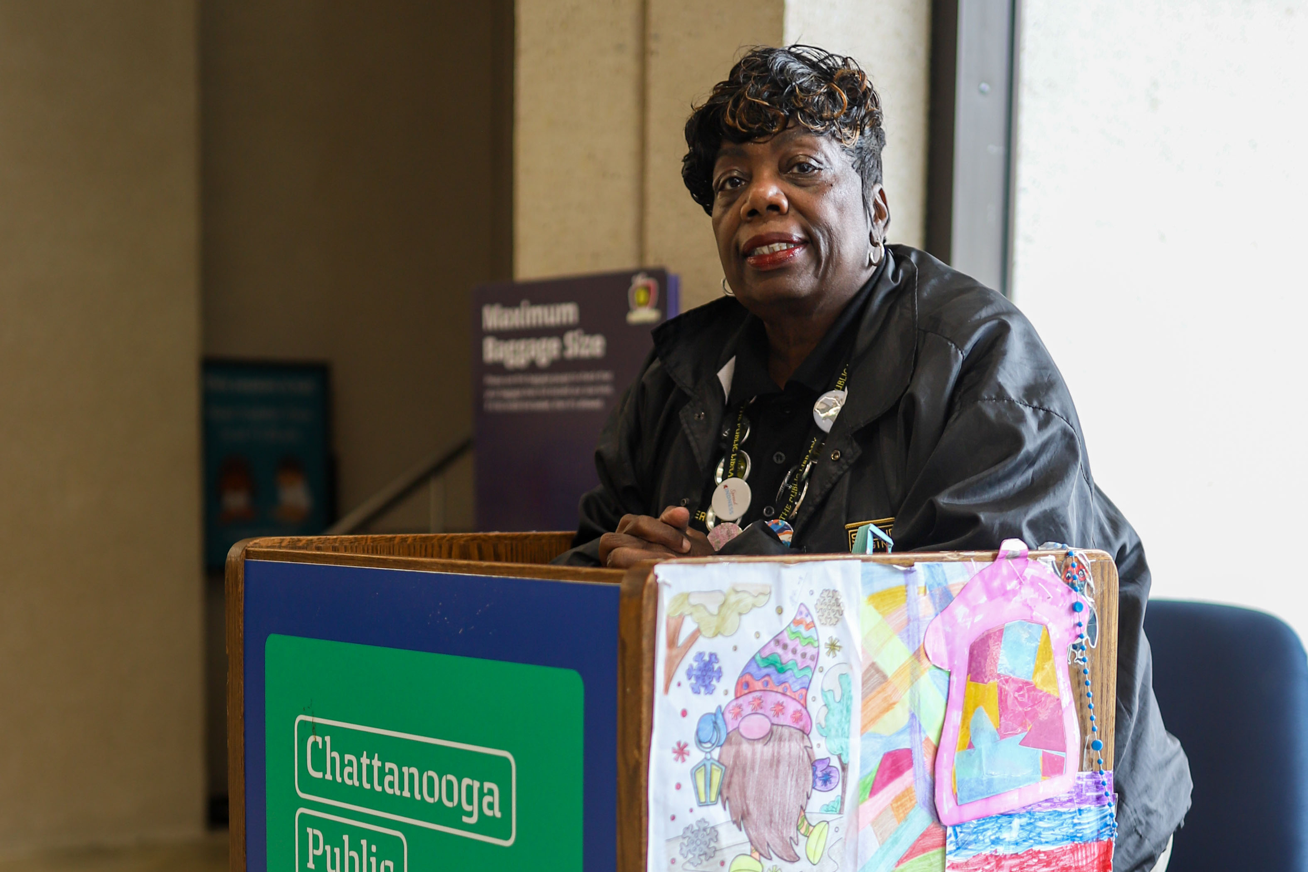 Staff photo by Olivia Ross / Security guard Jackie Strickland stands at her podium Tuesday at the Chattanooga Public Library downtown.