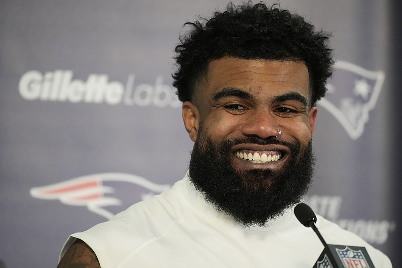 FILE - New England Patriots running back Ezekiel Elliott (15) speaks during a news conference after an NFL football game Sunday, Dec. 24, 2023, in Denver. The Dallas Cowboys are reuniting with running back Ezekiel Elliott after agreeing to terms on a contract with the former two-time rushing champion, a person with knowledge of the deal said Monday, April 29, 2024.(AP Photo/David Zalubowski, FIle)