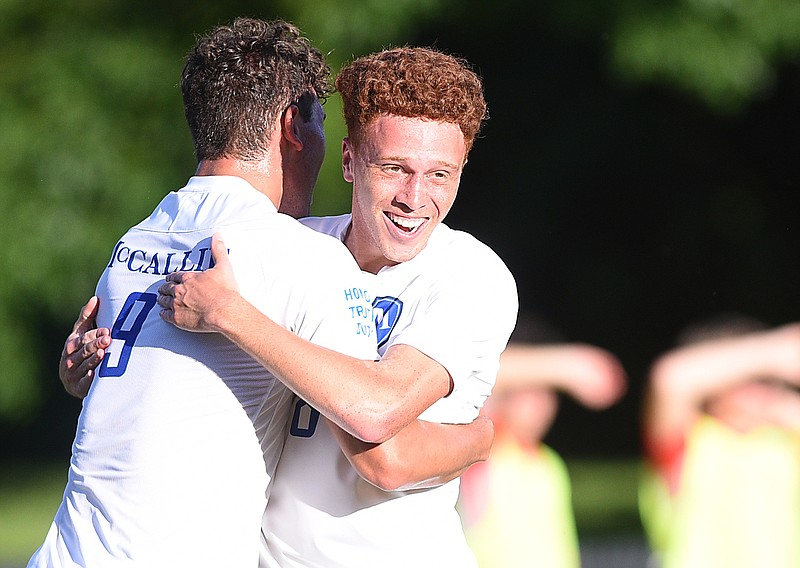 Staff photo by Matt Hamilton/ McCallie (9) Dylan Capazario hugs (8) Brandon Mathurin after scoring a goal during their game at Baylor High School on Tuesday, April 30, 2024.