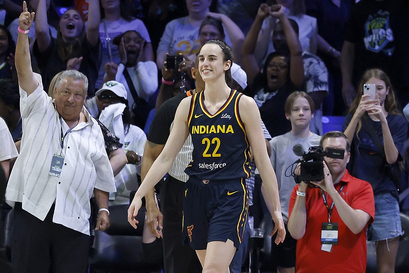AP photo by Michael Ainsworth / Indiana Fever guard Caitlin Clark made her WNBA debut in a preseason game against the Dallas Wings on Friday night in Arlington, Texas.