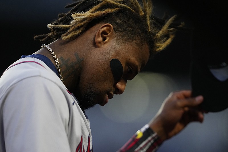 Atlanta's Ronald Acuña Jr. walks back to the dugout against the Seattle Mariners after striking out during the Braves' woeful road trip this past week. (AP Photo/Lindsey Wasson)