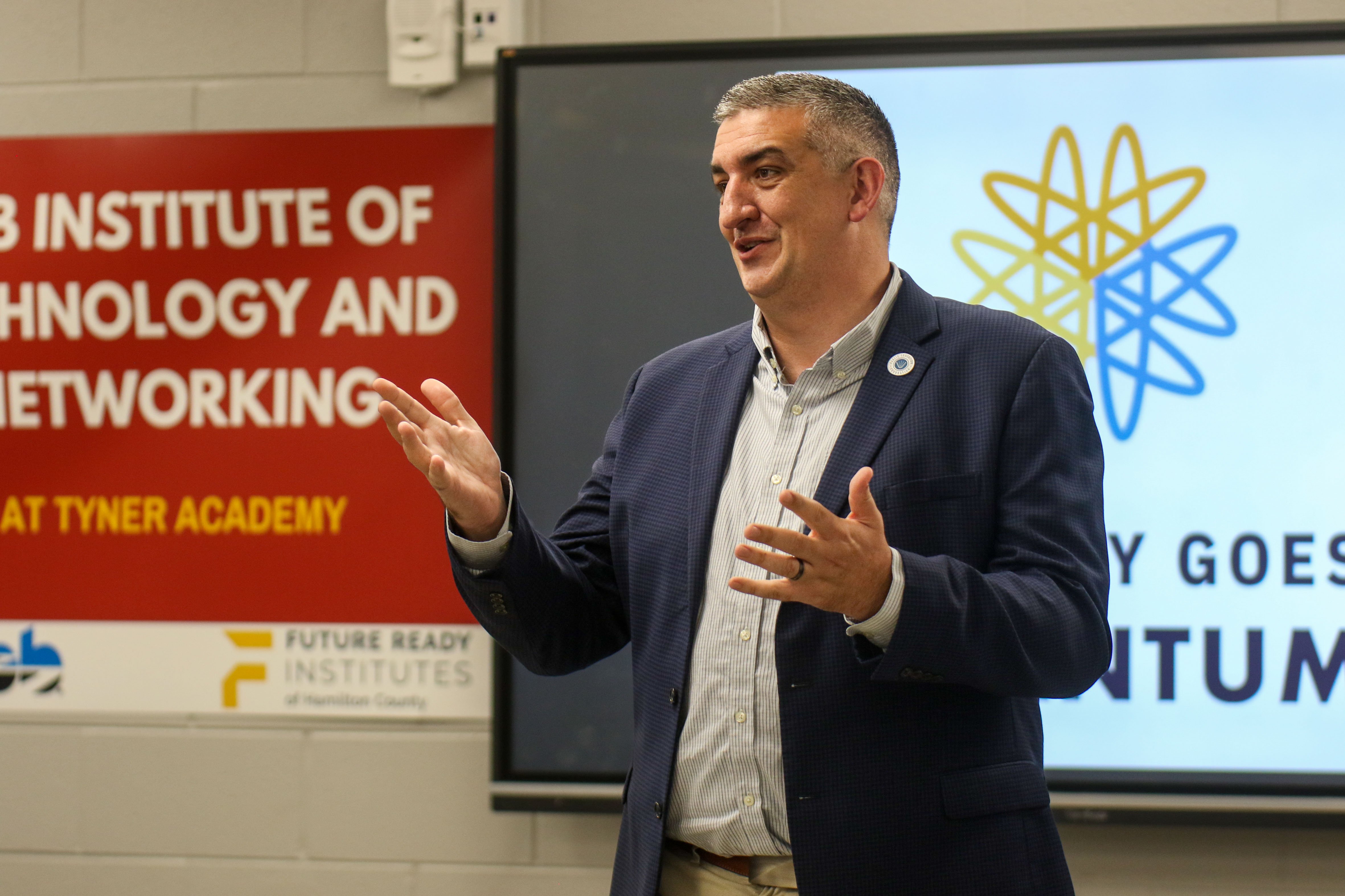 Staff photo by Olivia Ross / Michael Stone, vice president of innovative learning for the Public Education Foundation, speaks to the room. EPB Future Ready Institute of Technology and Networking students demonstrated their creations during Tyner's World Quantum Day showcase on Tuesday.