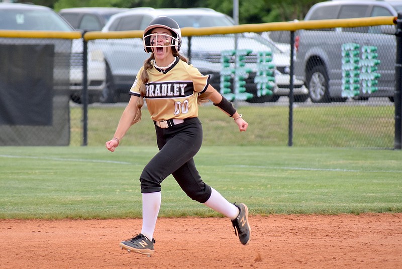 Staff photo by Patrick MacCoon / Bradley Central sophomore Miley Broom celebrates after hitting a two-run homer off the scoreboard in Wednesday's District 6-4A championship game at East Hamilton.