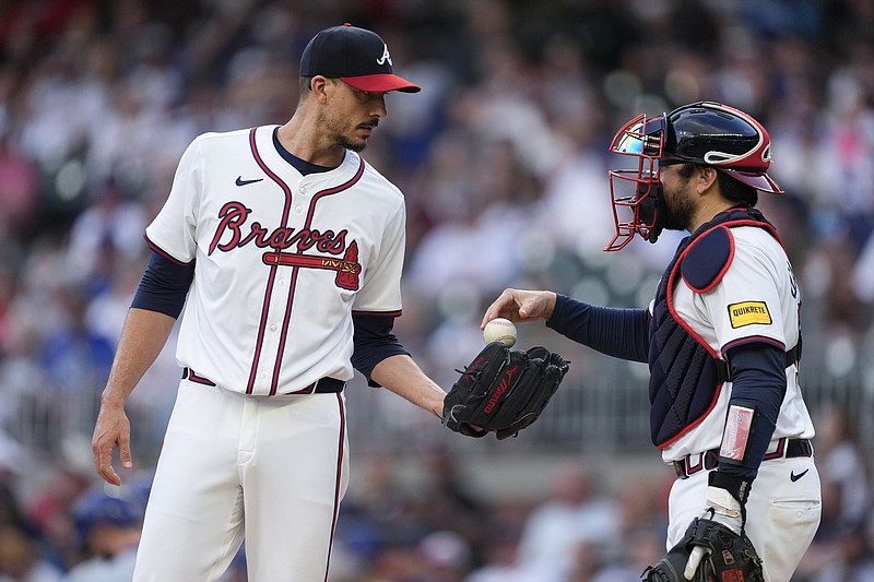 AP photo by John Bazemore / Atlanta Braves catcher Travis d'Arnaud, right, talks to pitcher Charlie Morton in the first inning of Wednesday night's home game against the Chicago Cubs.