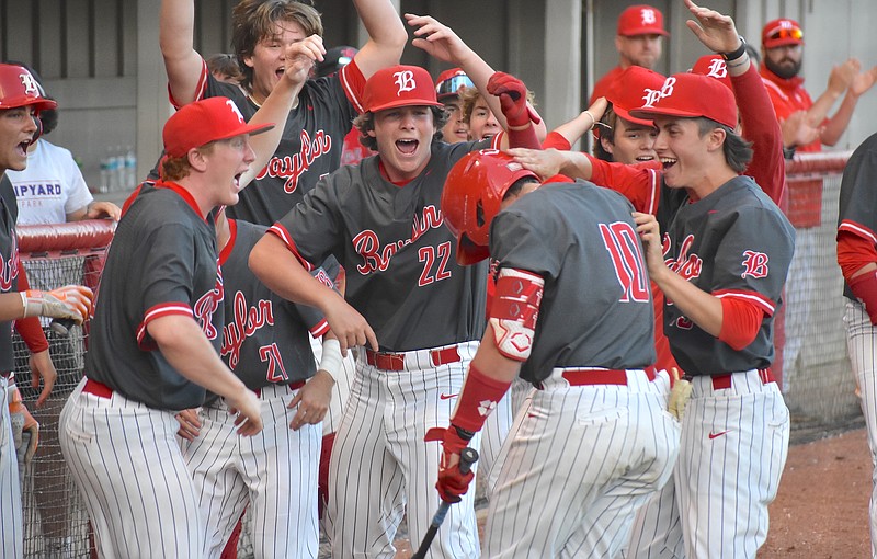 Staff photo by Patrick MacCoon / Baylor's Graham King (10) is mobbed by teammates after hitting the go-ahead sacrifice fly in the bottom of the sixth inning of Thursday's 8-6 home win over McCallie in a Division II-AA state quarterfinal series.