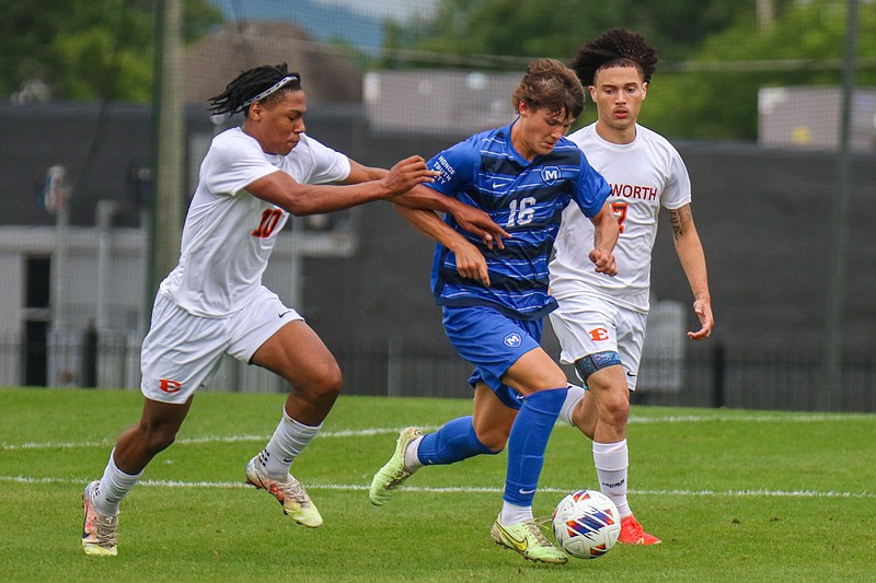 Staff photo by Olivia Ross / McCallie's Brooks Hilger (16) goes after the ball with Ensworth's Terrance Reynolds, left, and Zaidyn Moore following behind during a TSSAA Division II-AA quarterfinal Friday in Chattanooga.