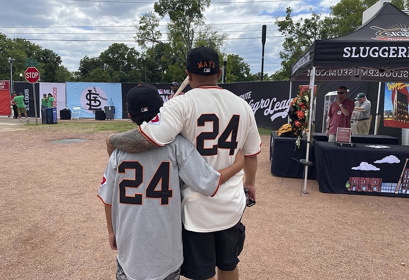 AP photo by Alanis Thames / Eddie Torres, right, and his son Junior wear San Francisco Giants jerseys with the late Willie Mays' No. 24 on the back Thursday at Rickwood Field in Birmingham, Ala.