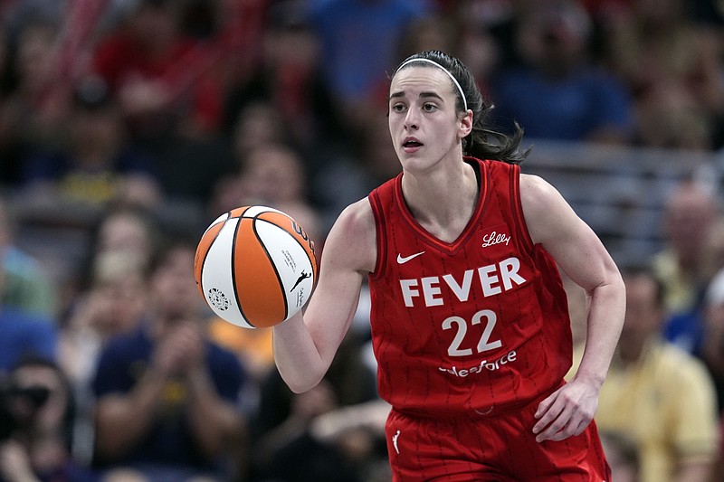 AP photo by Darron Cummings / Indiana Fever guard Caitlin Clark dribbles during last Saturday's home game against the New York Liberty, when she became the first rookie in WNBA history to post a triple-double.