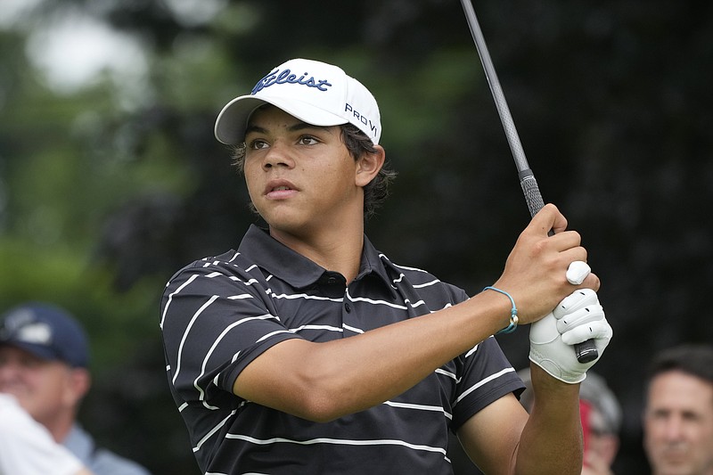 Charlie Woods drives off the 18th tee during the first round of stroke play of the U.S. Junior Amateur Golf Championship, Monday, July 22, 2024, in Bloomfield Township, Mich. (AP Photo/Carlos Osorio)