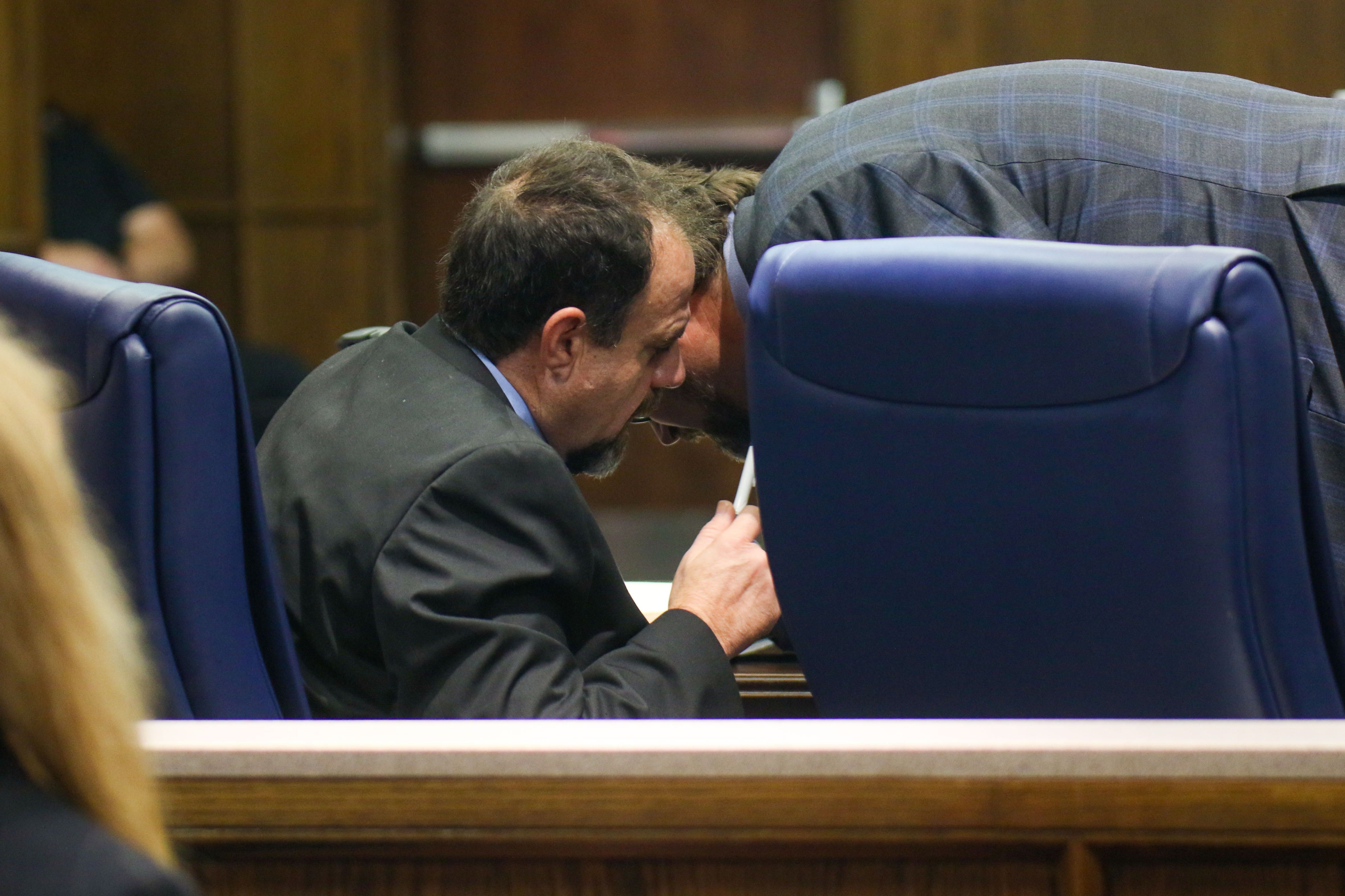 Staff photo by Olivia Ross / Raymond Rzeplinski, left, speaks with his attorney Ben McGowan during court Wednesday at the Courts Building in Chattanooga.
