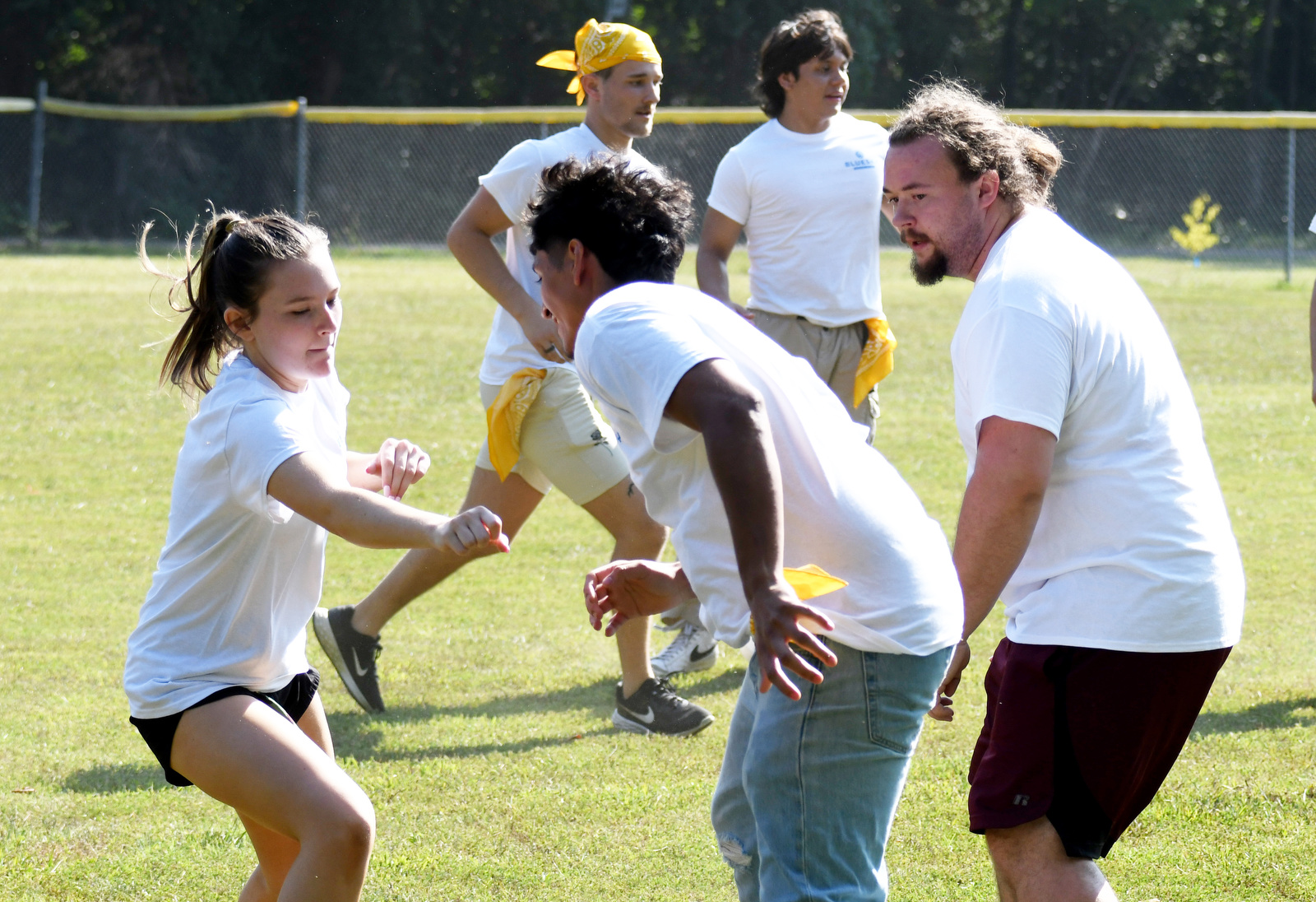 Staff Photo by Robin Rudd / Kelsey Boyd-Thompson, far left, pursues another team's member in a modified capture the flag during a color wars team building exercise at the St. Elmo Recreation Center on Aug. 20, 2024. The BlueSky Institute at BlueCross BlueShield Tennessee is a 27-month tech workforce development program that allows students to obtain a degree, learning from university professionals, and get a job with the company upon graduation.