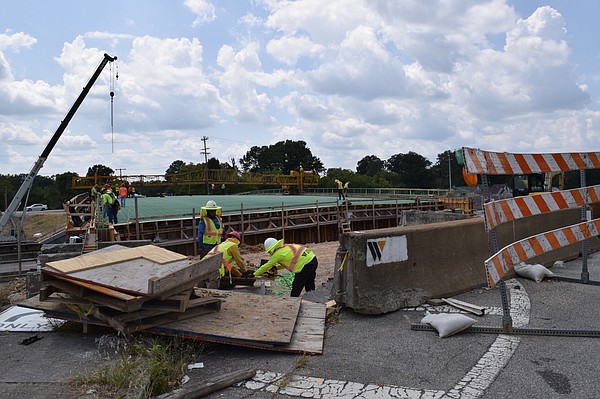 Work on concrete railings and decking on the South Moore and McBrien bridges in progress