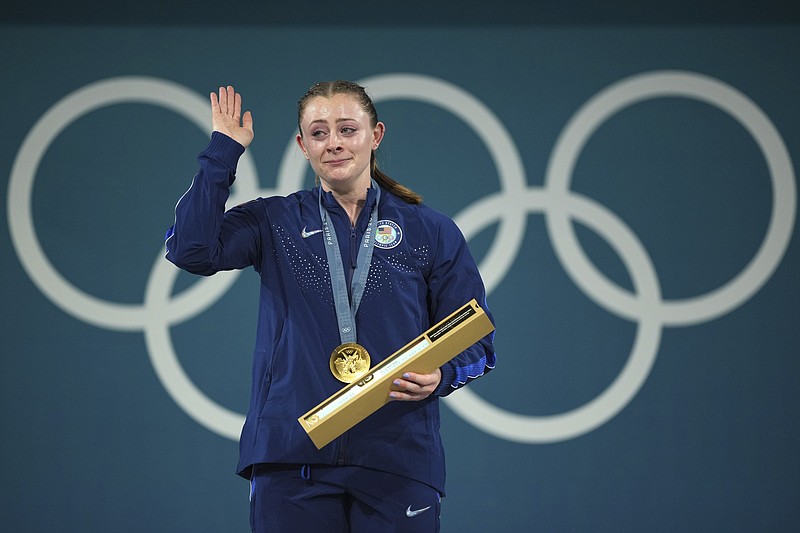 Gold medalist Olivia Reeves, of Hixson, celebrates Friday on the podium during the medal ceremony for the women's 71kg (156 pounds) weightlifting event at the 2024 Summer Olympics in Paris. (AP Photo/Kin Cheung)