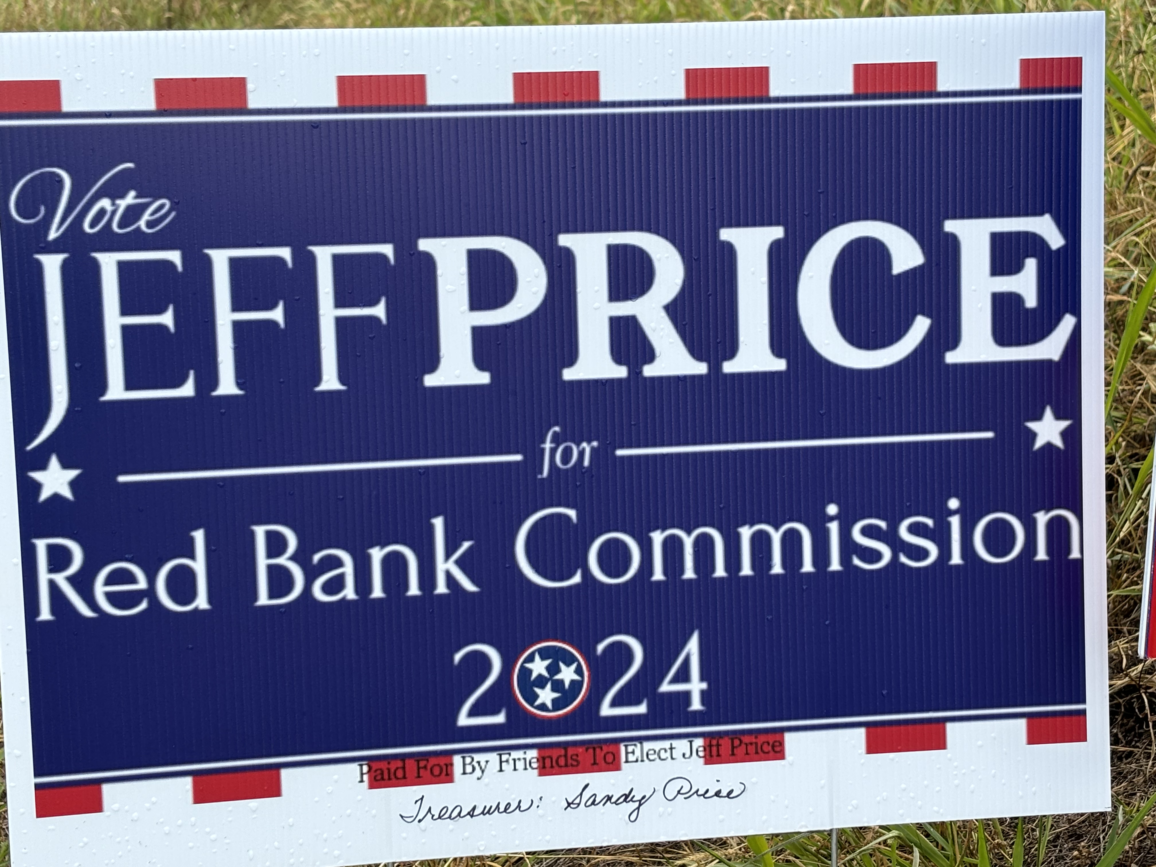 Staff photo by Emily Crisman / One of Red Bank City Commission candidate Jeff Price's campaign signs is shown with a handwritten disclaimer stating Sandy Price is his campaign treasurer.